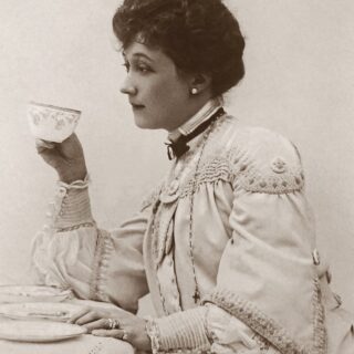 classic photo of a woman holding a tea cup