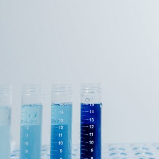 clear plastic vials with blue liquid